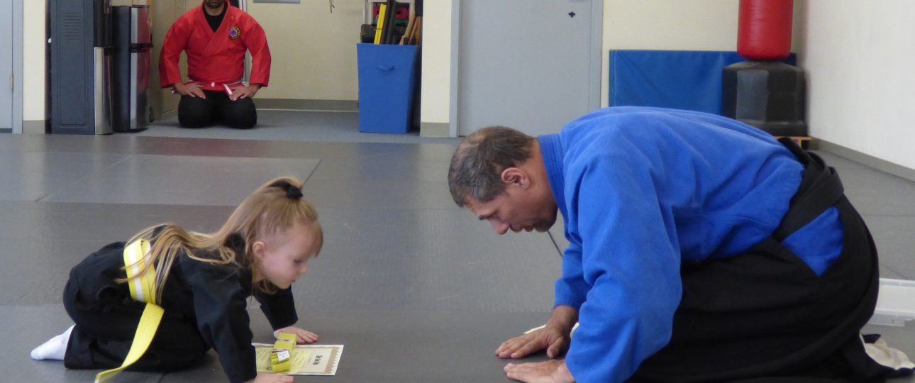 5 year old child in Kids Martial Art class bowing to Sensei (Japanese word for teacher) at Shin Gan Dojo